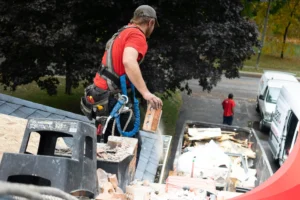 Junk removal crew loading debris onto a hauling truck in Glendale